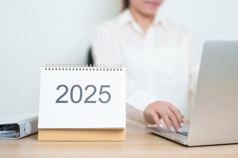 A calendar with 2025 written in grey