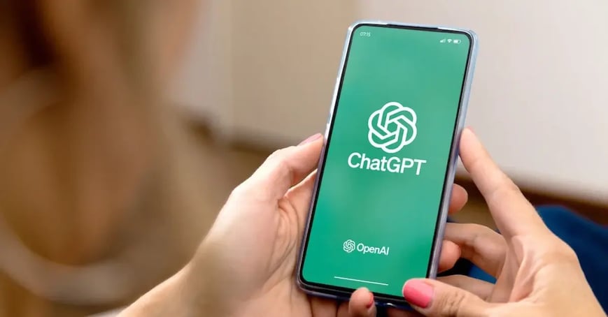 Executive Assistant Using ChatGPT AI on her cell phone